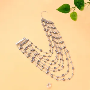 Exquisite multi-layer pearl ear cuff detail, elegant fashion bridal party accessory.