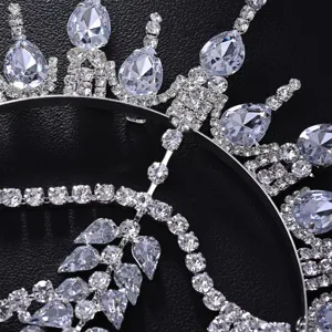 Detailed close-up view of the sparkling rhinestone tassel crown headpiece for festival wear.