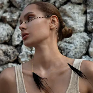 Bohemian face chain with black feathers and beads, stylish festival jewelry accessory for women.