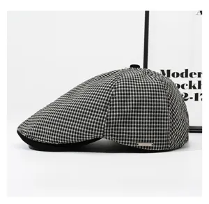 Classic black and white checkered flat cap for women, vintage beret for autumn casual wear.