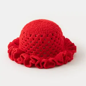 Red crochet hat hollow detail, handmade knit bucket hat texture, vintage style ruffles.