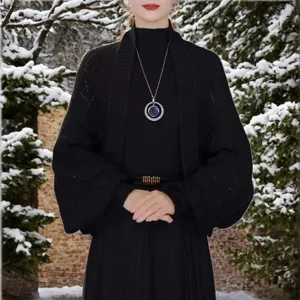 Black knit cardigan shawl for women, loose winter warm outerwear piece, outdoor detail.