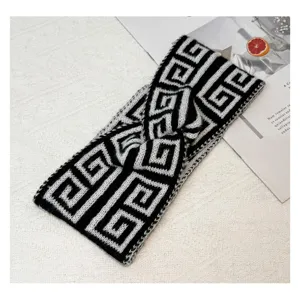 Chic black and white knit headband with classic geometric pattern, stylish cross design.