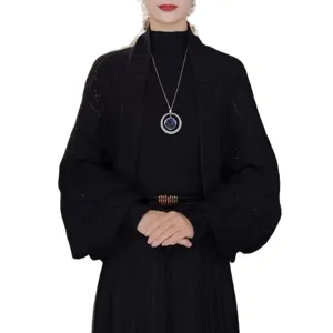 Stylish black knitted cardigan and versatile shawl for women, warm and loose outerwear.