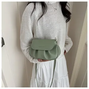 Stylish green pleated flap saddle bag for women, chic shoulder crossbody bag for daily use.