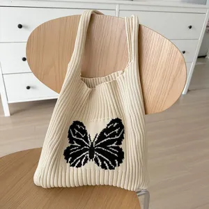 Women knit tote bag with stylish black butterfly pattern, casual large capacity wool shoulder bag.