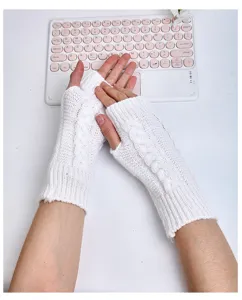 White cable knit fingerless gloves detail shot, cozy winter arm warmer close up view.