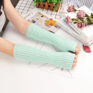 Mint green knit arm warmers for women, stylish sun protection sleeves for outdoor wear.