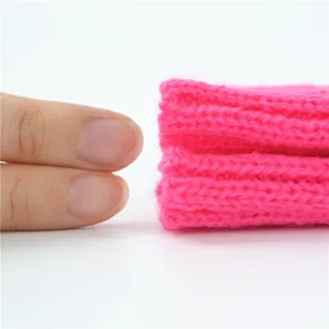 Bright pink knit arm warmer detail shot, soft texture, cozy warmth, spring autumn fashion.