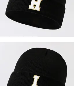 Black knitted beanie hat with white letter patch, stylish streetwear winter warm cap.