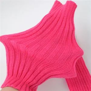 Detail shot of a fluorescent pink knitted arm sleeve showing unique star design and fine rib texture.