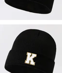 Black knitted beanie hat with letter K patch, winter warm streetwear casual cap for adults.