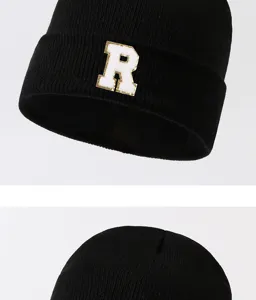 Black knit beanie hat for men and women, stylish winter warm cap with letter R patch detail.