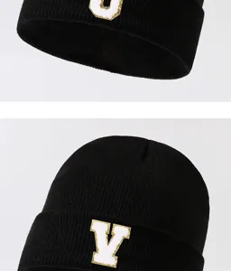 Black knit beanie hat with letter patch, stylish winter warm cap for men and women.