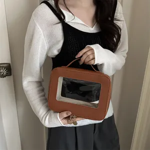 Borsa cosmetica marrone in pelle PU con finestra in PVC trasparente, custodia portatile per trucco.