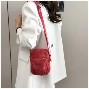 Compact red plaid mini crossbody phone bag, lightweight waterproof shoulder bag.
