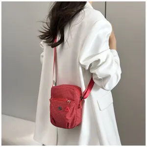 Compact red grid mini crossbody phone bag with zipper pocket, lightweight waterproof everyday use.