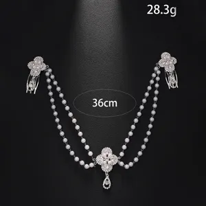 Multi-layer pearl hair chain with vintage rhinestones and teardrop pendant for bridal styling.