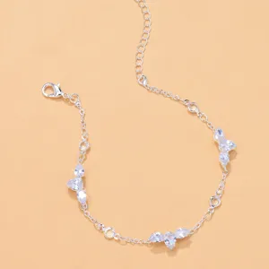 Stunning silver-tone anklet featuring sparkling waterdrop cubic zirconia stones and extension chain.