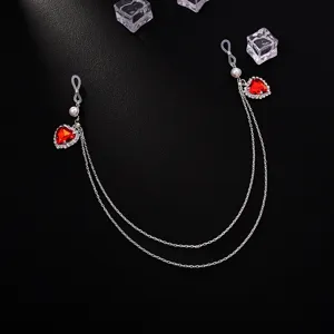Detailed view of the sparkling red heart rhinestone double chain body jewelry with pearl accents.