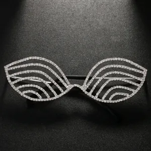 Close-up of geometric rhinestone festival glasses frames, sparkling crystal party eyewear decor.