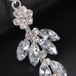 Exquisite rhinestone crystal mask pendant detail, sparkling clear gemstones for party decor.