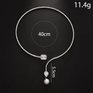 Close-up of a stunning pave rhinestone choker necklace featuring a elegant pearl pendant.