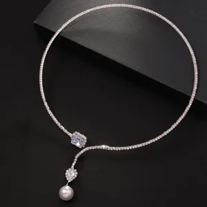 Elegant rhinestone choker necklace with pearl pendant, stylish silver tone jewelry piece.