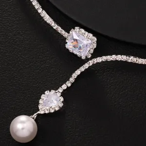 Exquisite silver rhinestone and pearl detail necklace, elegant minimalist fashion jewelry piece.