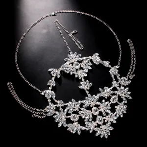 Rhinestone face chain detail showing sparkling crystal floral design for festival party masquerade.