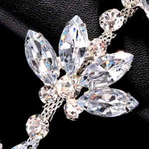 Exquisite rhinestone face mask detail featuring sparkling crystals and silver settings.