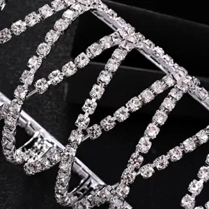 Sparkling rhinestone multi-layer cross ponytail holder detail, silver metal elegant hair cuff.