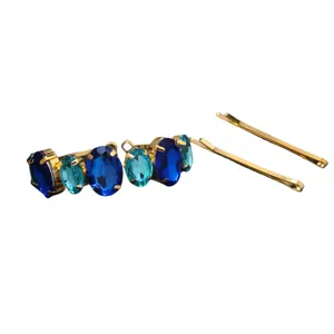 Elegant blue crystal hair clip set with gold tone metal, perfect for daily elegant styling.