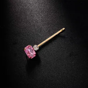 Exquisites vergoldetes Haarspange mit grossem rosa Strassstein und klarem Kristall. Detailansicht.
