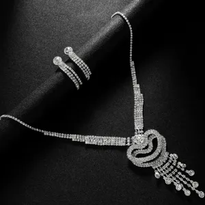 Sparkling rhinestone necklace tassel earrings set bridal jewelry detail close-up view accessory.