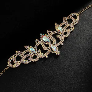 Sparkling rhinestone leg chain body jewelry with intricate hollow design and iridescent crystals.