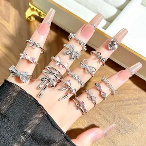 Closeup shot showing multiple exquisite bow zircon rings layered on fingers, perfect style.