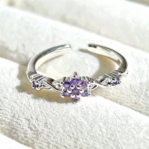 Silver-tone open ring featuring a purple cubic zirconia flower cluster with dainty side details.