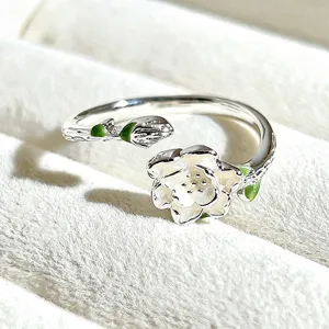 Sweet silver open ring with white enamel flower and green leaf details, cute floral jewelry.