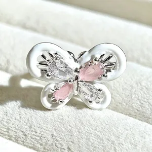 Sweet butterfly enamel ring with pink and clear cubic zirconia stones detail shot.