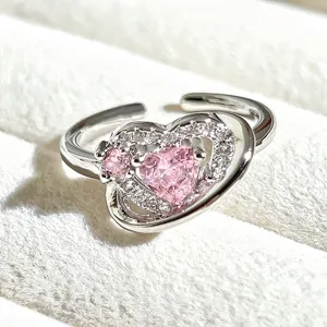 Close-up detail view of the sweet pink heart open ring featuring sparkling cubic zirconia stones.