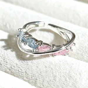 Charming sweet style open ring featuring silver-tone double band with blue and pink stones.