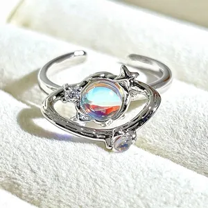 Chic silver-plated open ring featuring a stunning iridescent planet design with sparkling crystals.