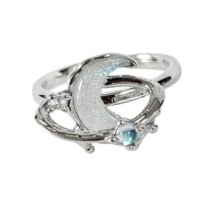 Silver celestial ring featuring a glitter moon and star orbit design with sparkling cubic zirconia.
