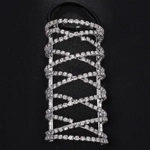 Close-up detail of silver rhinestone cross ponytail hair cuff wrap accessory shiny bling.