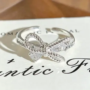 Silver bow open ring with sparkling cubic zirconia, chic niche design stackable jewelry for women.