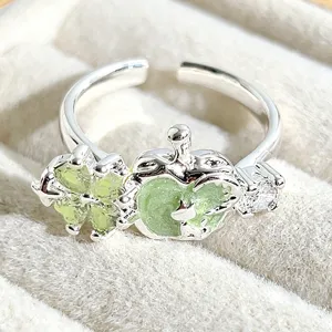 Close-up detail of the sweet enamel green apple clover silver open adjustable ring.