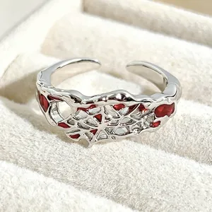 Open adjustable silver ring featuring red enamel drip spiderweb design for daily chic style.