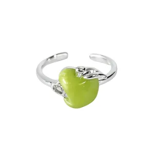 Exquisite detail of the green apple enamel ring featuring a cute open adjustable band.