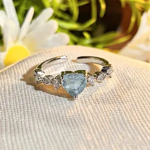 Close-up detail of stylish silver heart cubic zirconia open ring with sparkling crystal stones